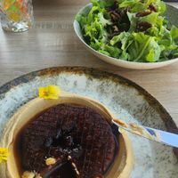Celery steak sous vide with creamy hummus and green salad at Folio Bistro by Paul Novac in Brasov