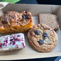gochujang black garlic focaccia, peanut banana bread, rose cake and chocolate chip cookie at Better Now in Brunswick East