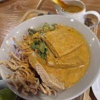 Curry noodles with fried tofu  at Thaiger Den in Malden