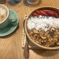Heerlijke smoothiebowl en cappuccino   at iVegan Supershop Hoi An - Healthy Plant Based Cafe in Hoi An