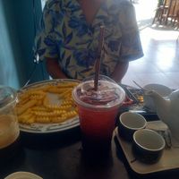 Iced macchiato, French fries, blueberry soda, tea at Honney Cafe & Slow Bar in Phonsavan