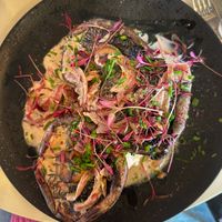 Toasted sourdough with three large flat poached mushrooms in a creamy sauce   at Coffee Woolston in Southampton