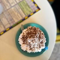 Hot chocolate with a huge swirl of vegan cream   at Coffee Woolston in Southampton