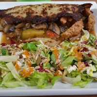 Placek po wegiersku or seitan and veggies in potato pancake at W Gruncie Rzeczy in Warsaw