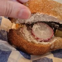 One delicious sandwich with vegan cream cheese, radish, olives, lettuce, and pickle 😋 at Namo Bakery in Warsaw