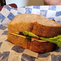 Sandwich with vegan cream cheese, vegan cheese, radish, tomato, and lettuce. The bread is delicious. at Namo Bakery in Warsaw