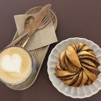 Cappuccino and cinnamon pastry  at Namo Bakery in Warsaw