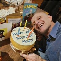 Happy hubby with vegan cake!  at Around the World Bakes in Preston