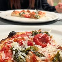 parmigiano vegano, salsiccia vegana, cime di rapa e pomodorini   at Languorino in Cesena
