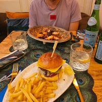 Vegan burger for me and a non vegan dish for my partner at MALQUERER in Sevilla