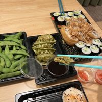Pictured, salted edamame in pods, vegetarian assorted set 27 pieces, vegetable gyoza’s and from the specials spicy tofu onigiri rice balls.  at More Than Sushi in Poole