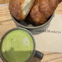 Matcha latte with a croissant and pain chocolat   at Land & Monkeys - Montmartre in Paris