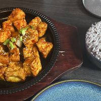 Fried sweet chilli Tofu and steamed ricee  at Soju Pocha 소주포차 in Porto