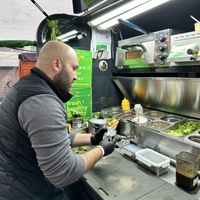 Hard work for the pita  at Adams Pita - Food Stand in Amsterdam