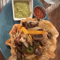 Taco Salad with rice, beans (make sure they’re vegan - server confirmed they are but just in case), mushrooms, guac and fajita veggies.   at Guimo's in Sun Prairie