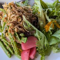 Snap pea salad with tofu and greens - so creative! at Satdha Plant Based Thai Kitchen in Santa Monica