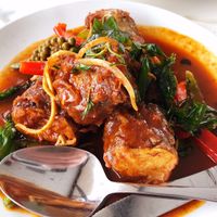 Catfish Eggplant: Battered eggplant wiht red curry paste, bell peppers, young pepper corn and Thai basil at Satdha Plant Based Thai Kitchen in Santa Monica