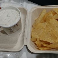 To go order of three layer bean dip with chips and salsa at Bueno Loco Restaurante in Falmouth