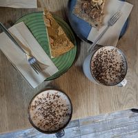 Spiced apple cake, Biscoff cheesecake and oat milk hot chocolate. All vegan at Aris Healthy Life in Exeter