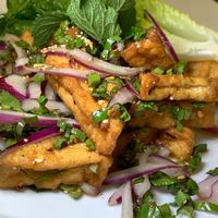 Larb Tofu: Fried Tofu w/ Red Onions, Scallions, Cilantro, Mint, Lime Juice, Chili Powder, Ground Roasted Rice at Thai Table in Grand Rapids