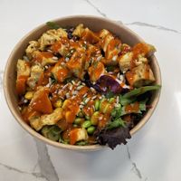 Puff tofu on half-and-half (half red rice and half spring mix) with a variety of toppings.  at Blowfish Poke & Grill in Marriottsville