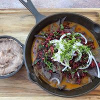 Chilaquiles con frijoles ha el lado. at Lupe 87 in Villa De Juarez