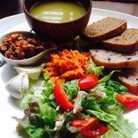 Vegetable soup, salad, pickled carrots, curried lentils and vegan cheese served with toasted bread at Organic House Salute in Kyoto