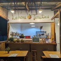 The outside of the site, with outdoor seating at Lemons and Tomatoes in San Vicente Palawan
