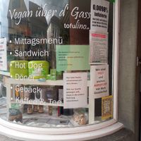 Posters downplaying covid-19 at Tofulino in Winterthur