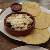 Cazuelita de champiñones con frijoles,  queso vegano y tortillas. at La Chaparrita in Sevilla
