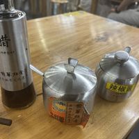 complementary sauces: vinegar, spicy mushroom sauce, chilli oil  at Longhua Temple in Shanghai