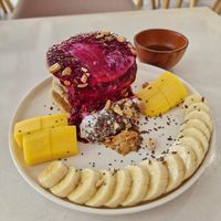 Yummy pancakes that didn't taste sweet (thankfully!) I was clumsy as I turned the plate, they placed the cream beautifully on top 😉 at KURUMI - Healthy Vegan Food & Desserts in Hoi An