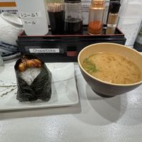 The two items I got, peanut miso onigiri on the left with some peanuts on top and tofu miso on the right. Water and cups available self serve along with chop sticks    at Onigiri Gorichan in Osaka