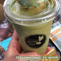 Vegan shamrock shake with tiny gluten free donut at The Sweet Beet in Granby