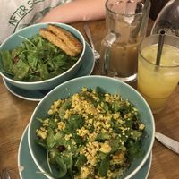 grilled tempeh brunch salad, and tofu scramble brunch salad with oat milk latte and peach mimosa  at Le Vespe Cafè in Florence