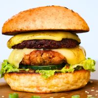 This is a serious veggie burger, our patty is made with tempe, mushrooms, red beans, red rice and beets.  at Fairy Kale Vegetarian in Yogyakarta