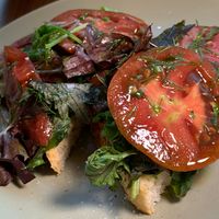 Heirloom Tomato Open-Faced Sandwich: Fresh Greens, Vegan Green Goddess Mayo, Sunflower Bac'n Brittle, Chives, Toasted Italian Bread at The Sovengard in Grand Rapids
