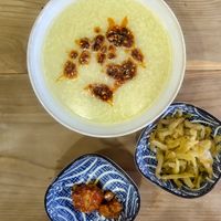 Millet porridge with chilli oil, fermented tofu, and pickles at Bao and Congee Shop - 众善缘包粥铺 in Dali