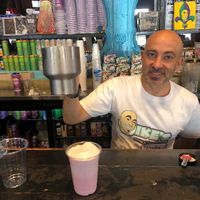 Ike, the owner, mixing magic elixirs  at Ike's in New Orleans