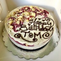 Jam ripple cheesecake ice cream cake with chocolate truffle chunks and chocolate biscuit base.  at Iced Out  in Dubai