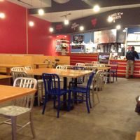 View of counter and seating. at Dimo's Pizza - Logan Square in Chicago