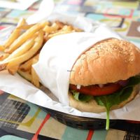 Tempeh burger (delicious patty) & fries & pickle at Afternoon Deli in Grass Valley