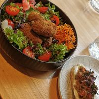 Bowl with tofu balls and bruschetta at Vegan Brunch in Riga
