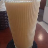 Mango pineapple orange smoothie without yogurt and with oat milk at Dream Beans Coffee Roastery in Hanoi