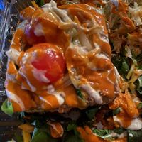 Lasagna with a side of marinated cabbage  at All The Way Live in Philadelphia