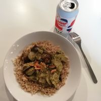 Thai green curry on a bed of brown basmati topped with toasted almond, Steep Soda cola at Sidney Street Cafe in Manchester