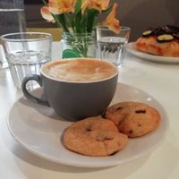 Oat latte and chocolate chip cookies at Sidney Street Cafe in Manchester