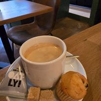 Coffee , comes with oatly at Kosmopoliet in Bruges