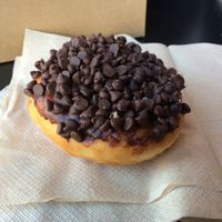 Darth Vader doughnut: mini chocolate chips on top with vanilla creme inside at Glory Doughnuts & Diner in Frederick
