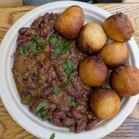 Kún mit Poff Poff, Bohneneintopf mit frittierten Teigbällchen at Kilimanjaro African Food in Dortmund